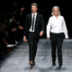 Italian designers Maria Grazia Chiuri and Pier Paolo Piccioli appear at the end of their Fall/Winter 2016/2017 women's ready-to-wear collection for fashion house Valentino in Paris, France, March 8, 2016. REUTERS/Gonzalo Fuentes/File Photo - RTX2HSU2